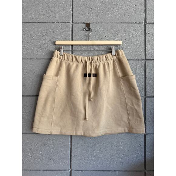 Women's Fear of God Essentials Fleece Mini Drawstring Skirt in Wheat size L - Picture 2 of 9